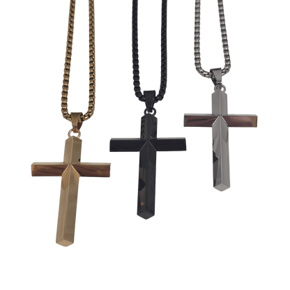 Three stainless steel cross pendants available in gold-silver and classic silver with a clean, high-polish mirror finish on a matching  box chain against a black background.