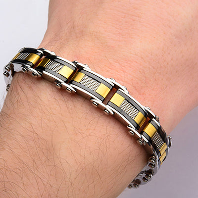 Close-up view of the INOX double-sided black IP and gold IP steel mesh reversible bracelet showing both dual finishes.