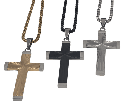 Gold black and silver-tone stainless steel cross pendant necklace featuring a radiant sunburst radial texture in the center, framed by smooth polished borders, hanging on a gold box chain against a black background.