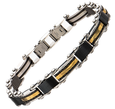 On-wrist view of the INOX men's reversible gold IP and stainless steel striped bracelet highlighting its slim, comfortable profile.