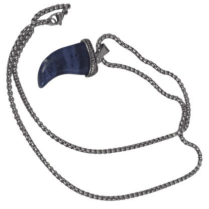 Natural stone blue shark tooth pendant necklace with a detailed metal cap and chain against a dark background