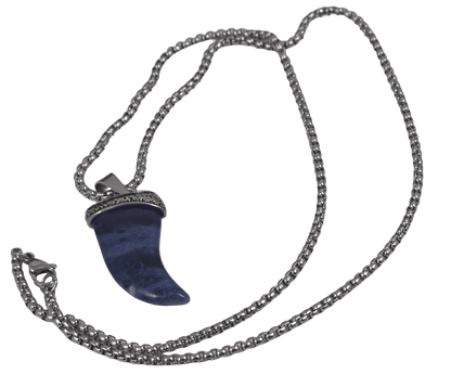 Natural stone blue shark tooth pendant necklace with a detailed metal cap and chain against a dark background angled.