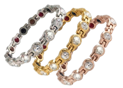 Collection of premium magnetic bio-health bracelets shown together in silver, gold, and rose gold finishes with crystal accents.